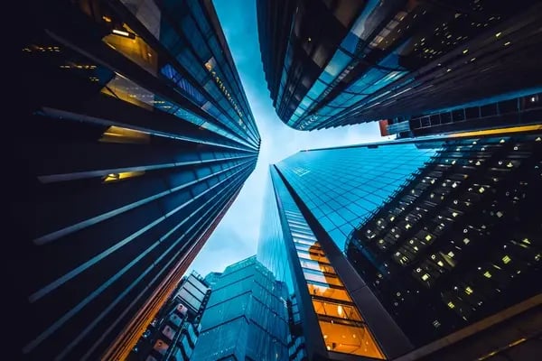 Bank Skyline with three skyscrapers seen from below, nearly touching each other on top